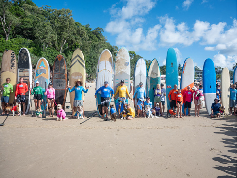 Crowd and competitors at the 2025 Surfing Dog Championships